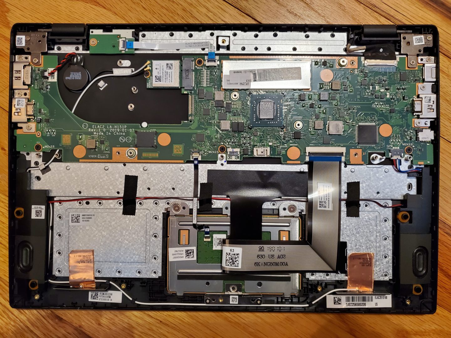photo of a Lenovo 14w 81MQ Laptop with the bottom cover, battery, and heatsink removed