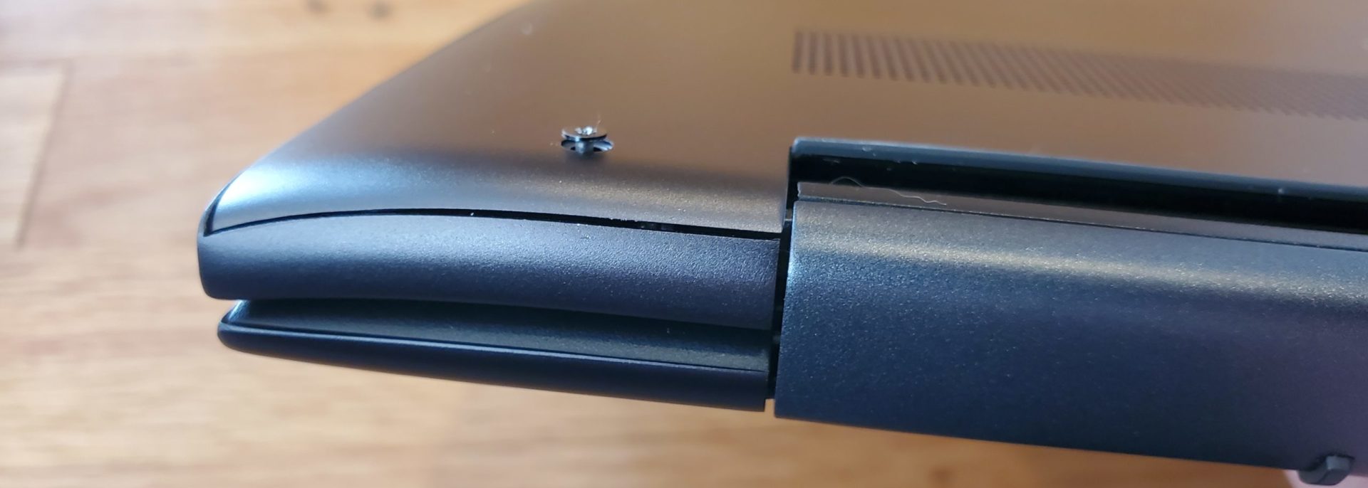 close up of a captive screw on the bottom cover of a dell inspiron 15 7000 2-in-1