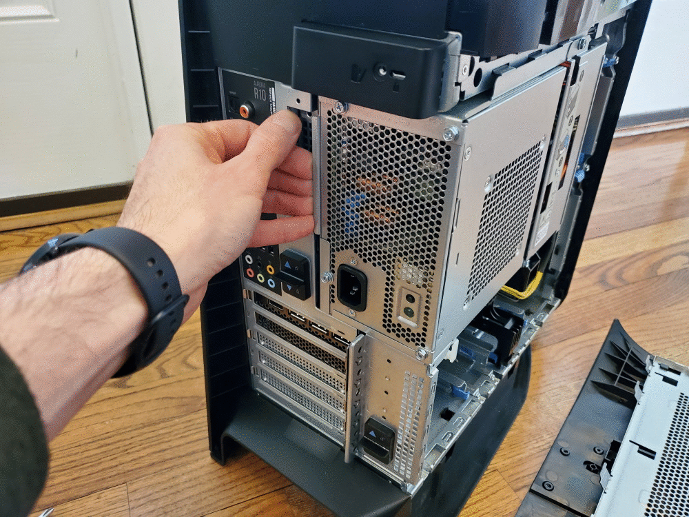 animated photo showing the power supply sliding out of the way, part of the how to guide to open an alieware aurora r10 case