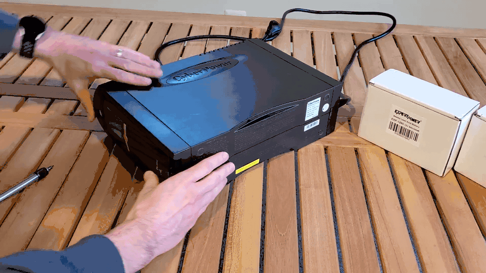 animated gif showing the front panel being removed from a cyberpower 1500va UPS