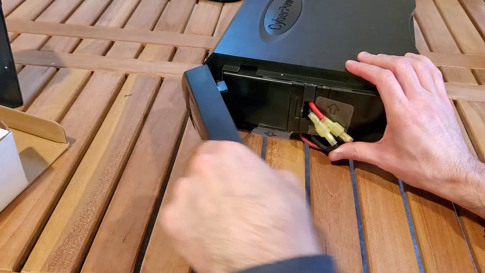 placing the front panel back on the UPS, part of the How to Replace a CyberPower 1500AV UPS Battery article